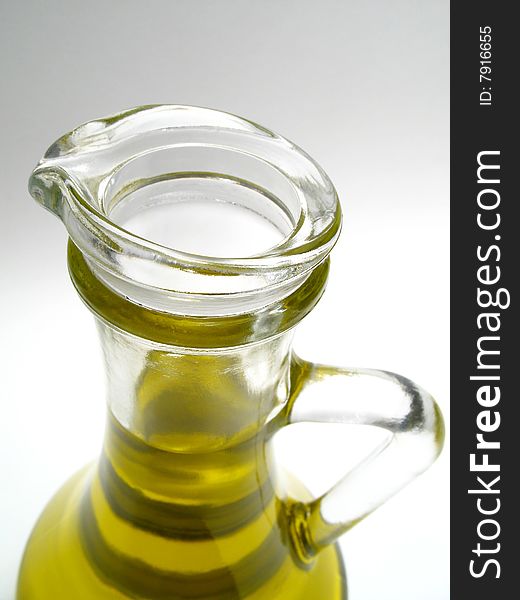 Olive oil in decanter, detail bottle with olive oil