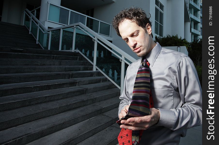 Man playing with two ties on his neck. Man playing with two ties on his neck