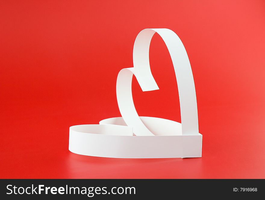 Two hearts, on red background. Focus on a front part. Two hearts, on red background. Focus on a front part.