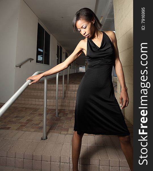 Woman Posing By Stairs