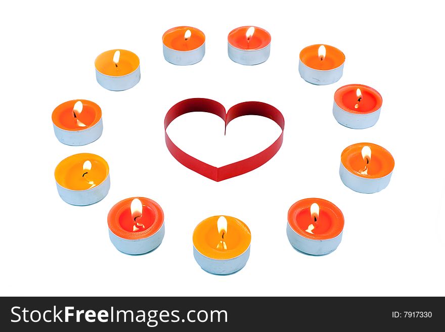 Single red  heart, surrounded small candles light, on a white background. Isolated on white. Single red  heart, surrounded small candles light, on a white background. Isolated on white.