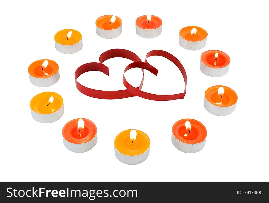 Small light candles,two red  hearts, on white.