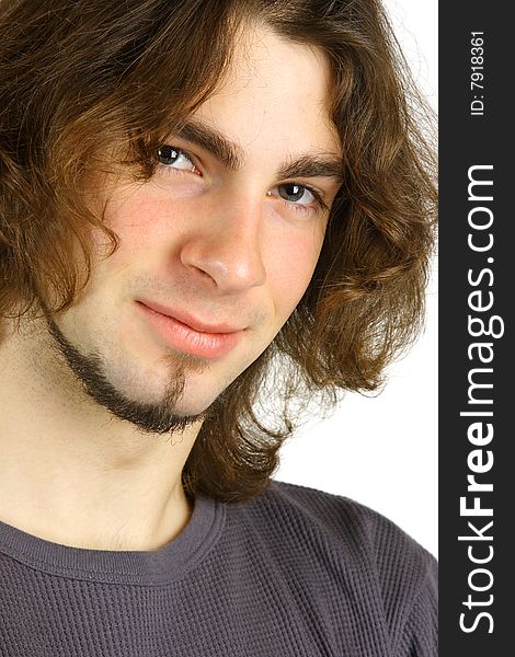 A portrait of an attractive young man against a white background.