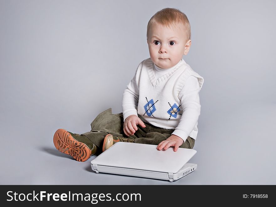 Small Baby With White Laptop