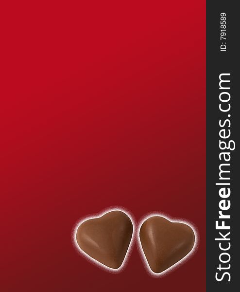 Two chocolate hearts on red background