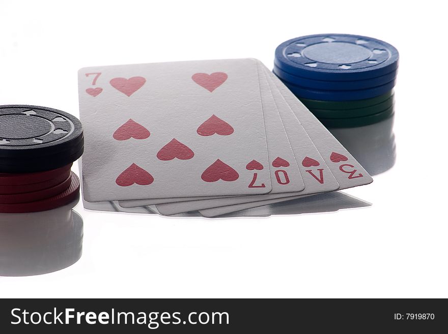 4 heart playing cards isolated on white spelling the word love with poker chips. 4 heart playing cards isolated on white spelling the word love with poker chips