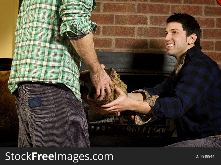 Man Giving Log To His Friend