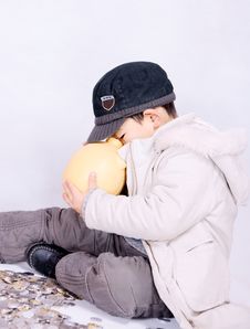 Boy And Coins Stock Photo
