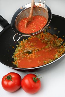Pressing Cooked Tomatoes Stock Photography Pressing Cooked Tomatoes Stock Photography