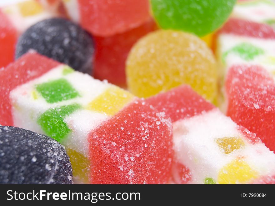 Sweet fruit color candy on white background