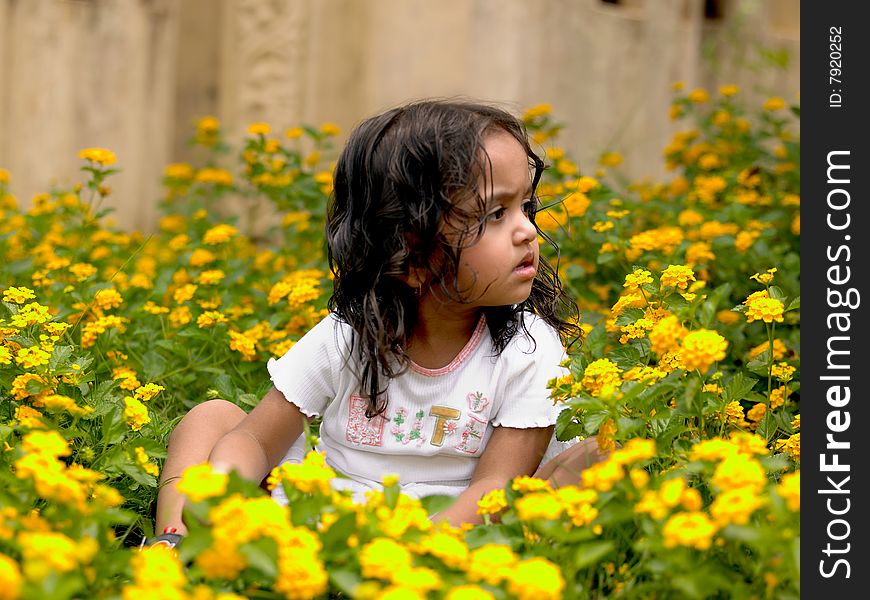 Beautiful Girl Among Flowering Plants