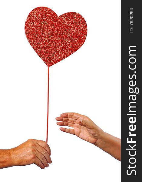Male handing red heart to female against a white background