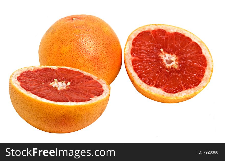 Close up of grapefruit and its sections isolated on white background
