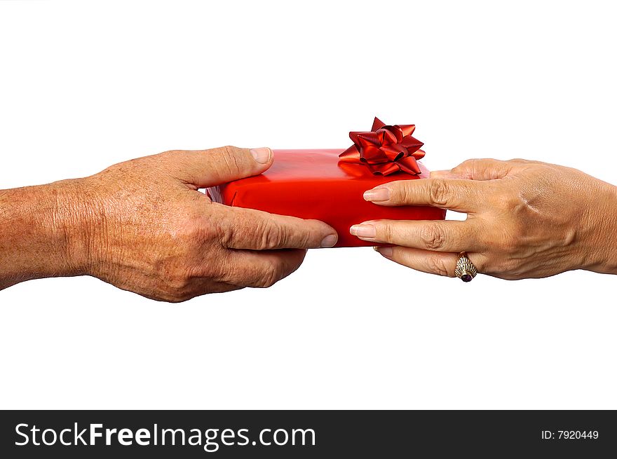 A male handing a gift over to a female. A male handing a gift over to a female