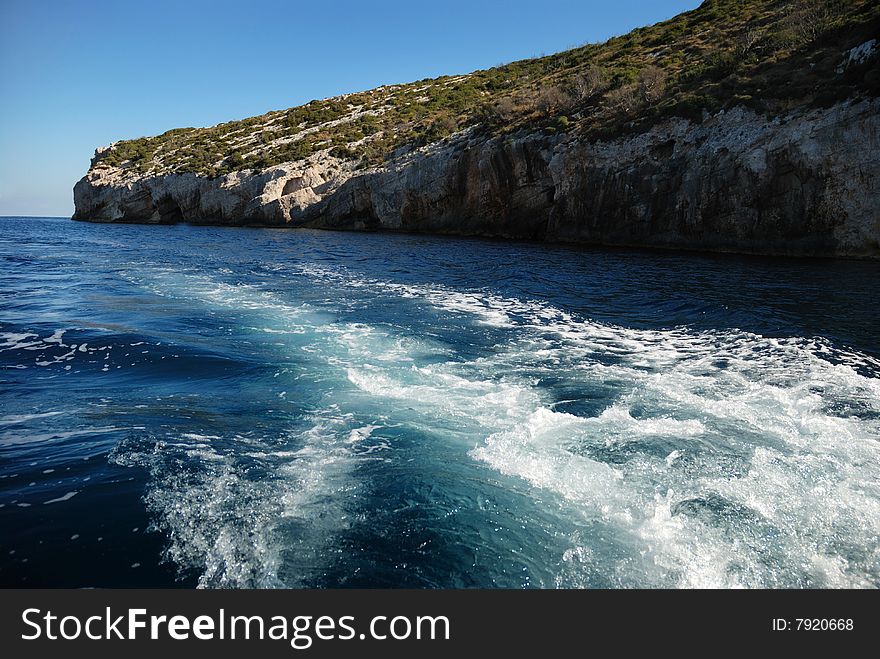 Coast, blue caves andwater on the Greece island. Coast, blue caves andwater on the Greece island