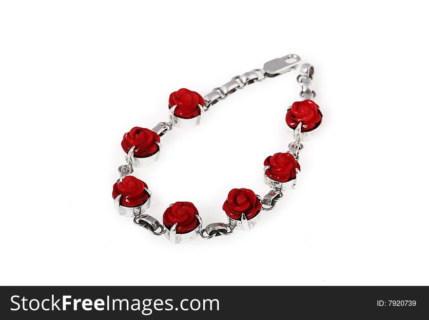 Unique bracelet made of silver and coral beads, isolated on white. Unique bracelet made of silver and coral beads, isolated on white.