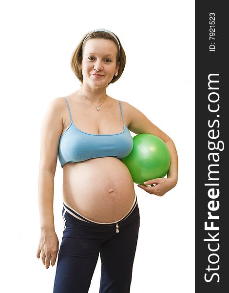 Young pregnant woman with green ball