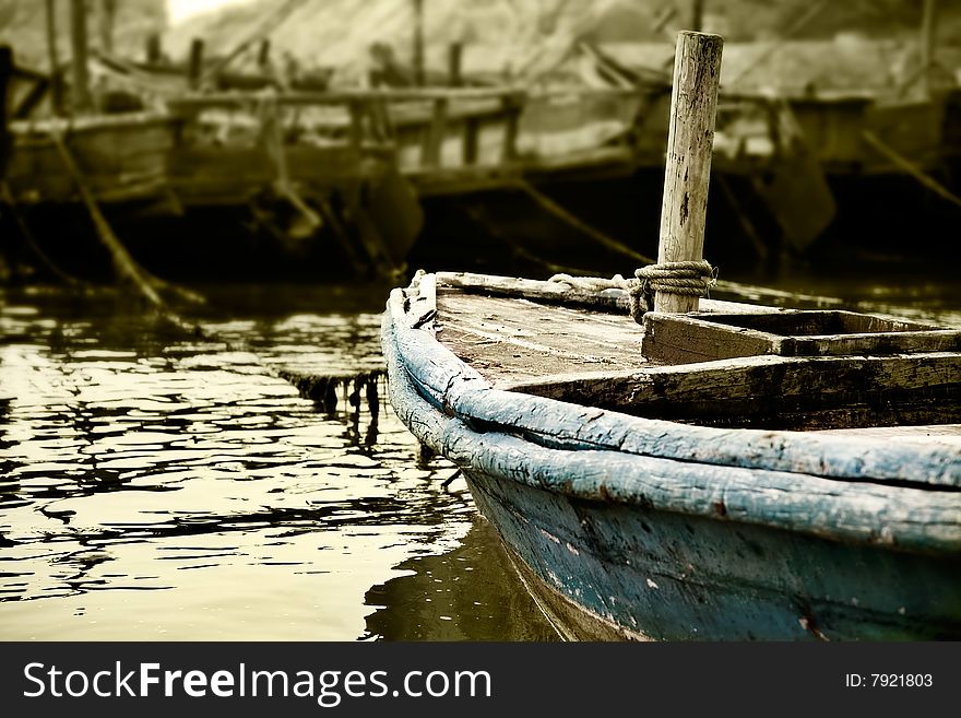 Old fishing boat docked at the shore. Old fishing boat docked at the shore