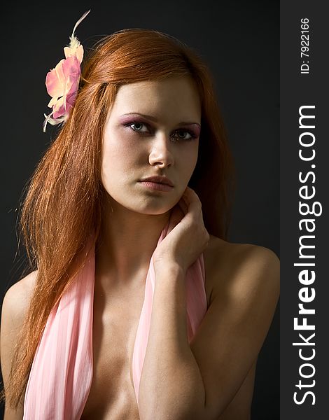 Beautiful women with pink flower in her hair