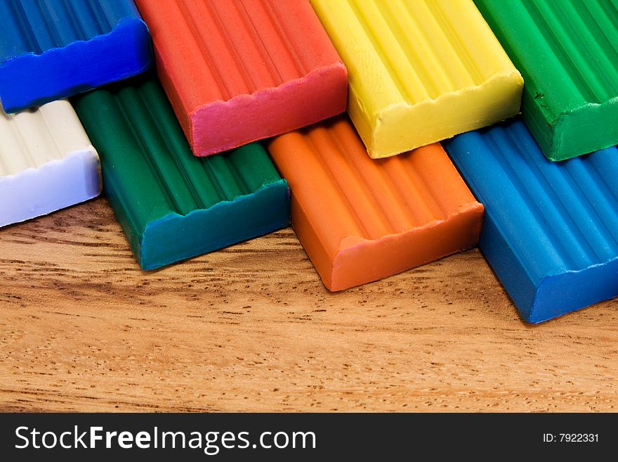 Plasticine on a wooden background