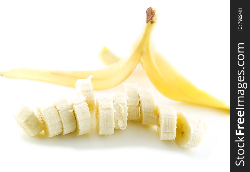 Yellow banana slices isolated on white background