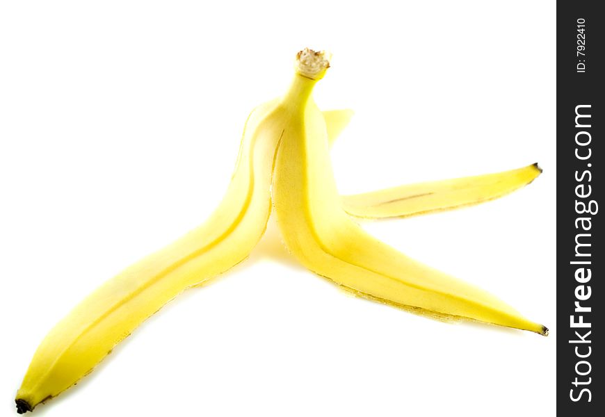 Yellow banana peel isolated on white background