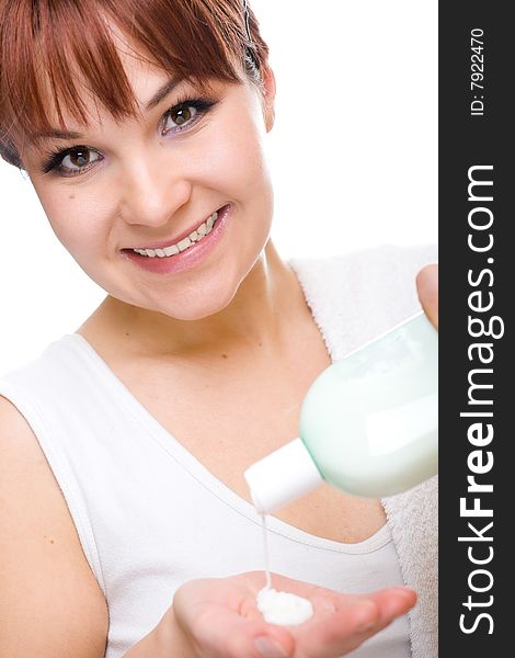 Attractive  woman applying cream. over white background. Attractive  woman applying cream. over white background