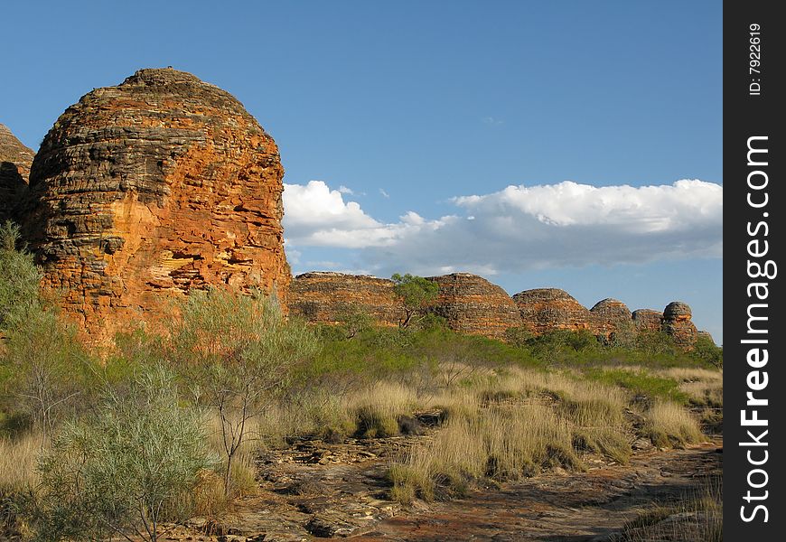 Cloudscape over shrubby vegetation and famous rock formations in Bungle Bungle national park, Western Australia. Australia