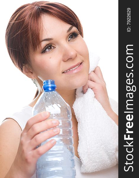 Attractive thirsty woman with bottle of water