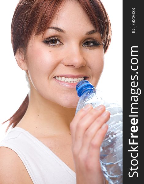 Attractive thirsty woman with bottle of water