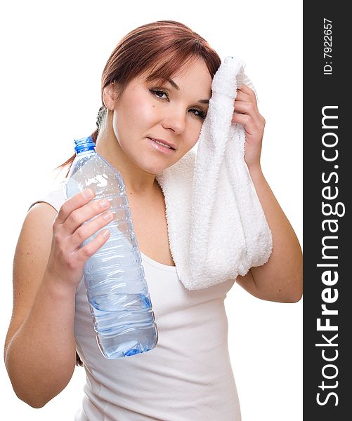 Attractive thirsty woman with bottle of water