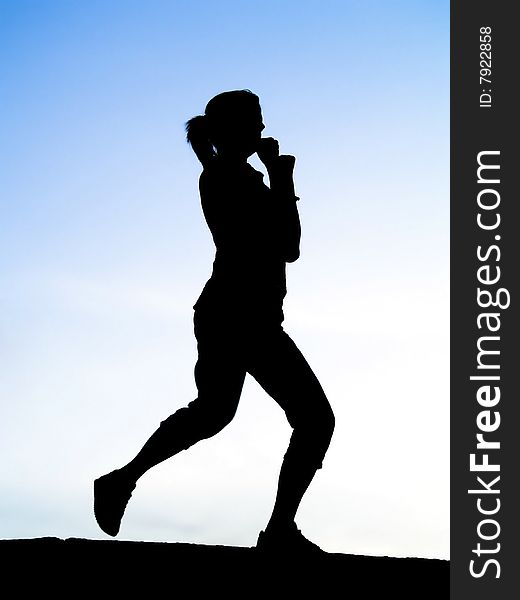 Silhouette of young sport woman or girl