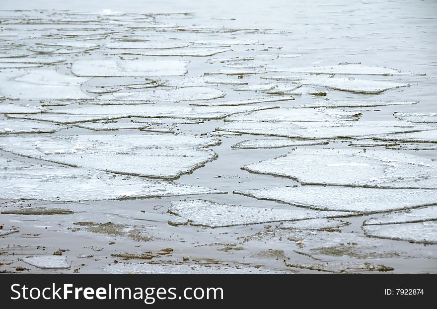 Ice floating on water surface seasonal background. Ice floating on water surface seasonal background