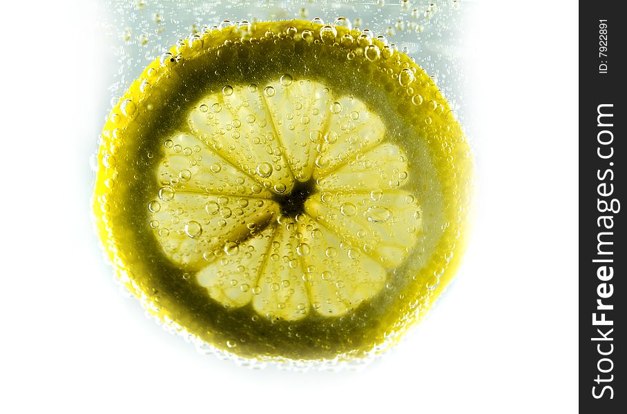 Photo of lemon slice fruit and bubbles