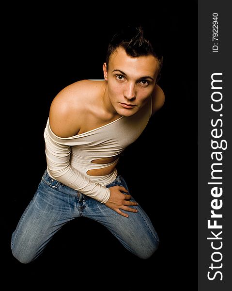 Young Sensual Man On A Black Background