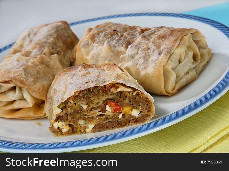 Rolled pastry with meat