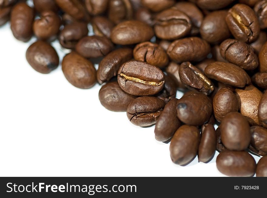 Close up of coffee beans isolated on white background