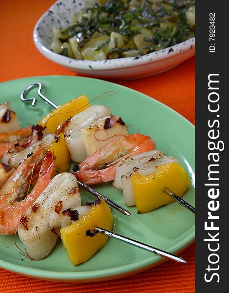 Shrimp, squid and yellow pepper skewers