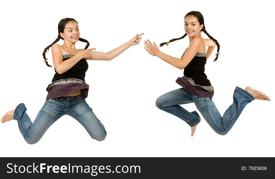 Two identical girls  jumps on a white background