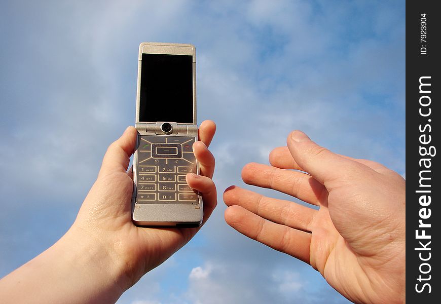 Hand holding a mobile phone for support