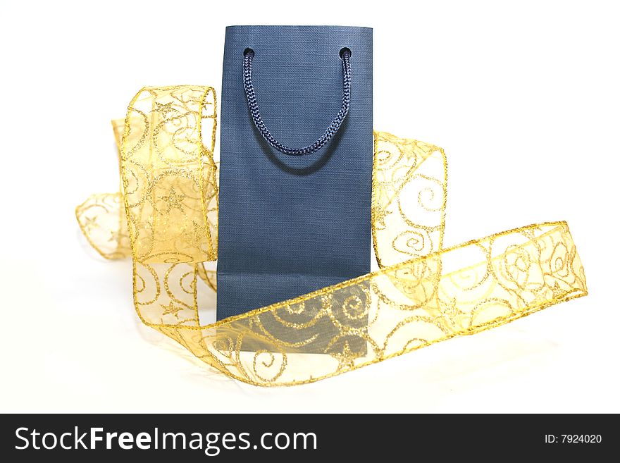 Gift package with a gold ribbon on a white background