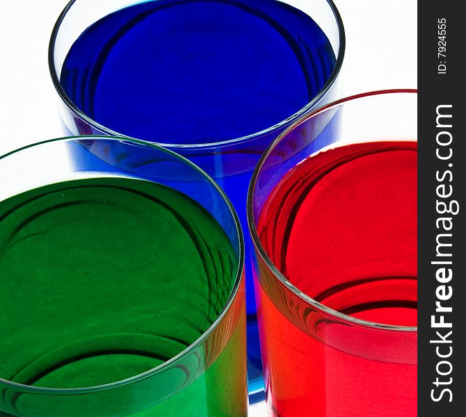 Glass with drink red, blue and green color. Glass with drink red, blue and green color