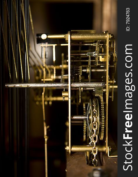 Inner workings of an old fashioned grandfather clock. Inner workings of an old fashioned grandfather clock