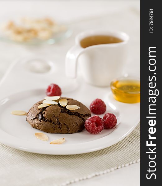 Chocolate cookie with raspberries  and tea. Chocolate cookie with raspberries  and tea