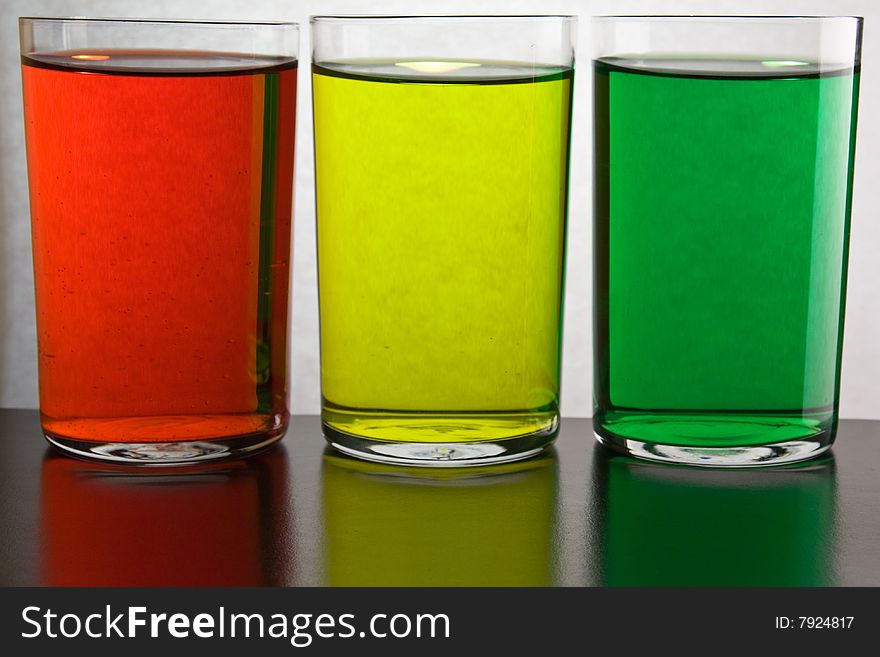 Glass with drink red, green, 	
yellow color. Glass with drink red, green, 	
yellow color