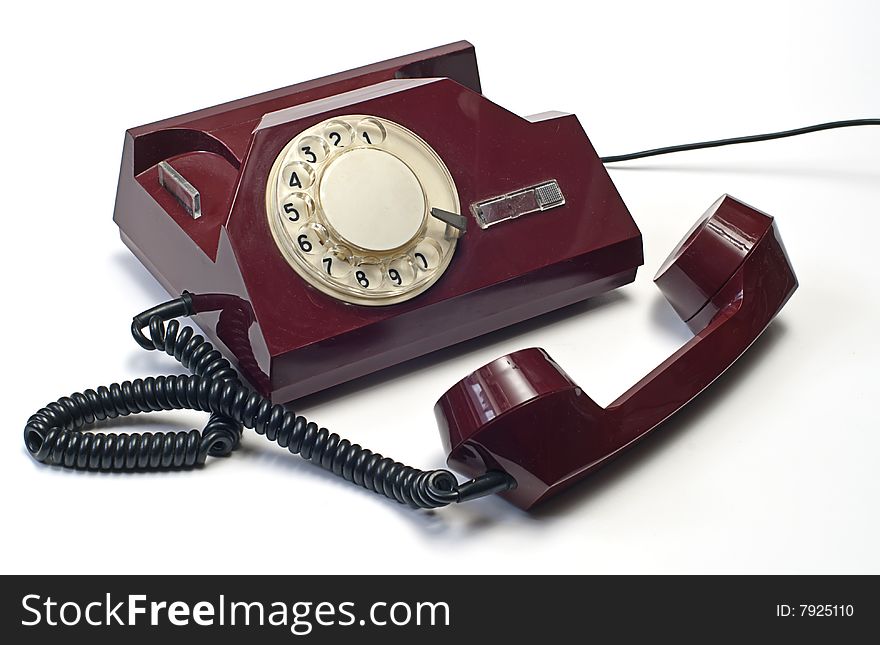 Old telephone on white isolated