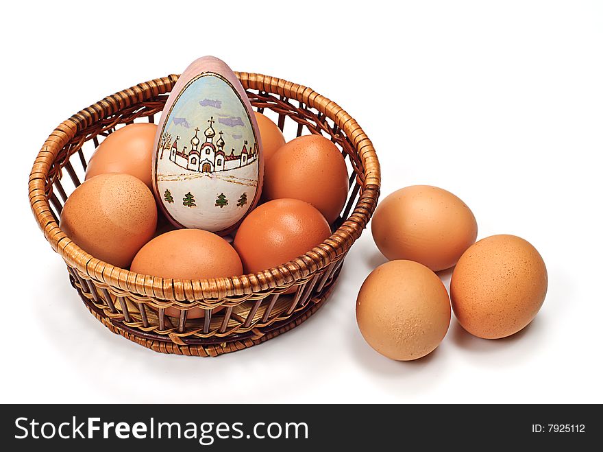 Easter egg in wooden basket on white. Easter egg in wooden basket on white