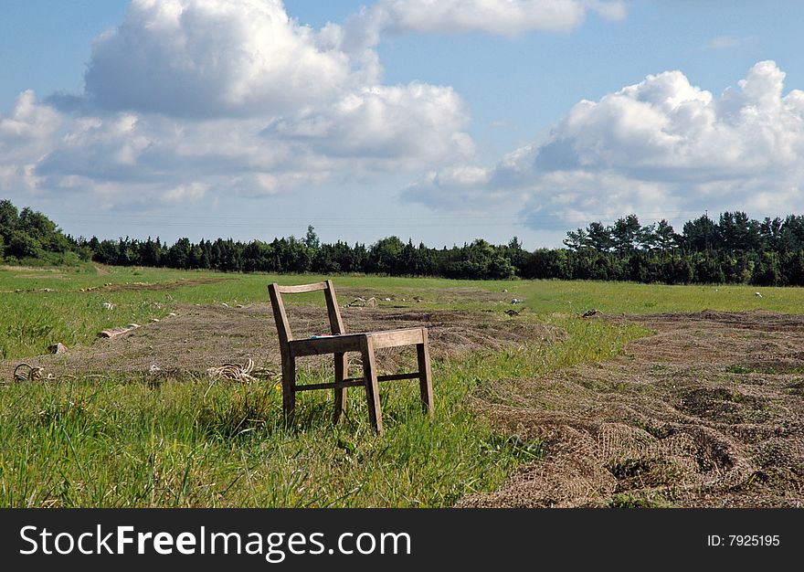 Fishnet dry on meadow with seat at summer. Fishnet dry on meadow with seat at summer