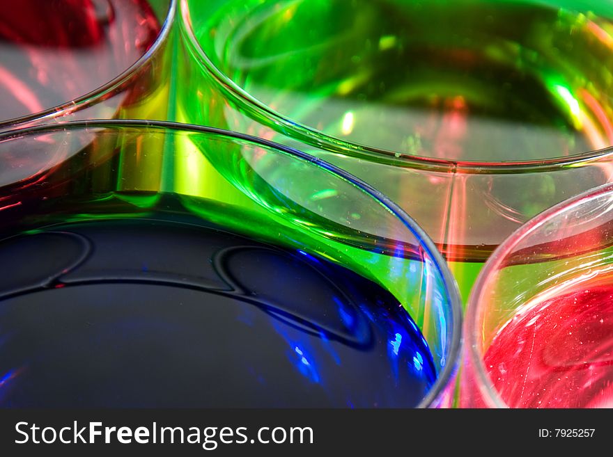 Glass with drink red, blue and green color. Glass with drink red, blue and green color