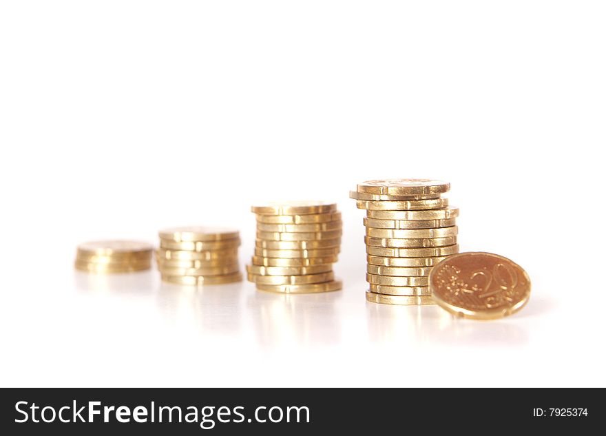 Stacked up coins. Coins are mirrored. Isolated over white. Ideal Businesshot. Stacked up coins. Coins are mirrored. Isolated over white. Ideal Businesshot.